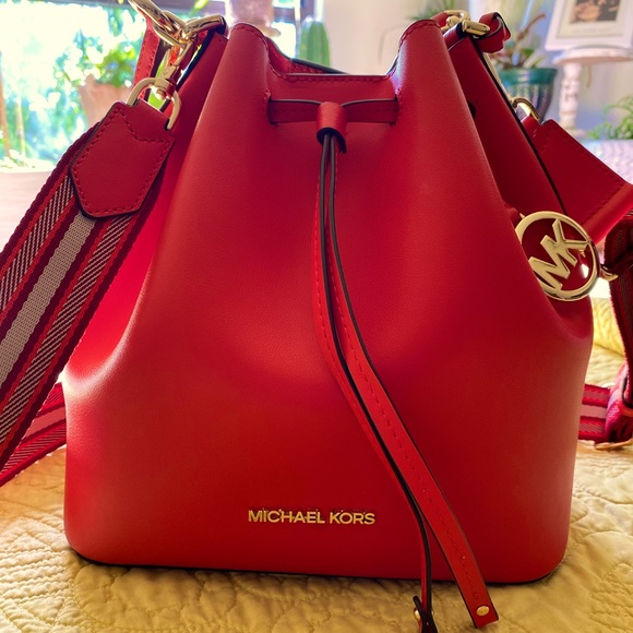 Michael Kors Handbags - Super beautiful the color is orange with red.